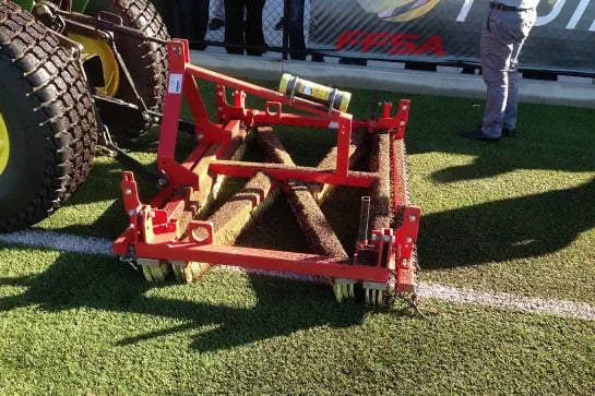 Close up of a maintenance machinery tool for sports surfaces