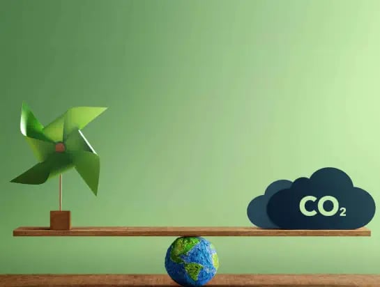 Drawing of a balance with a small planet Earth model, a toy sized eolian and CO2 cloud