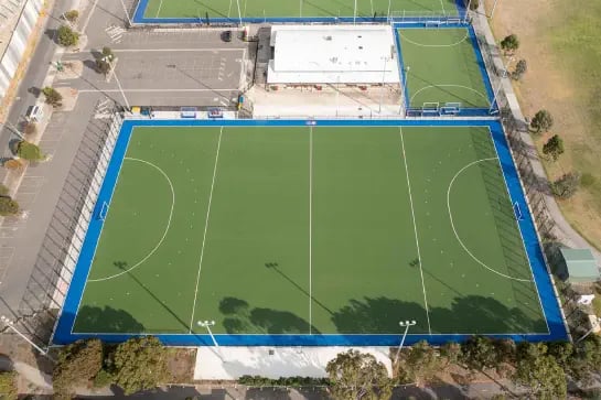 Aerial view of an outdoor synthetic turf hockey sports field