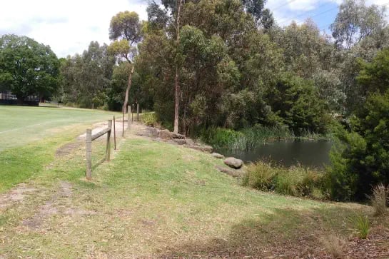 Creek next to a natural turf rugby sport field